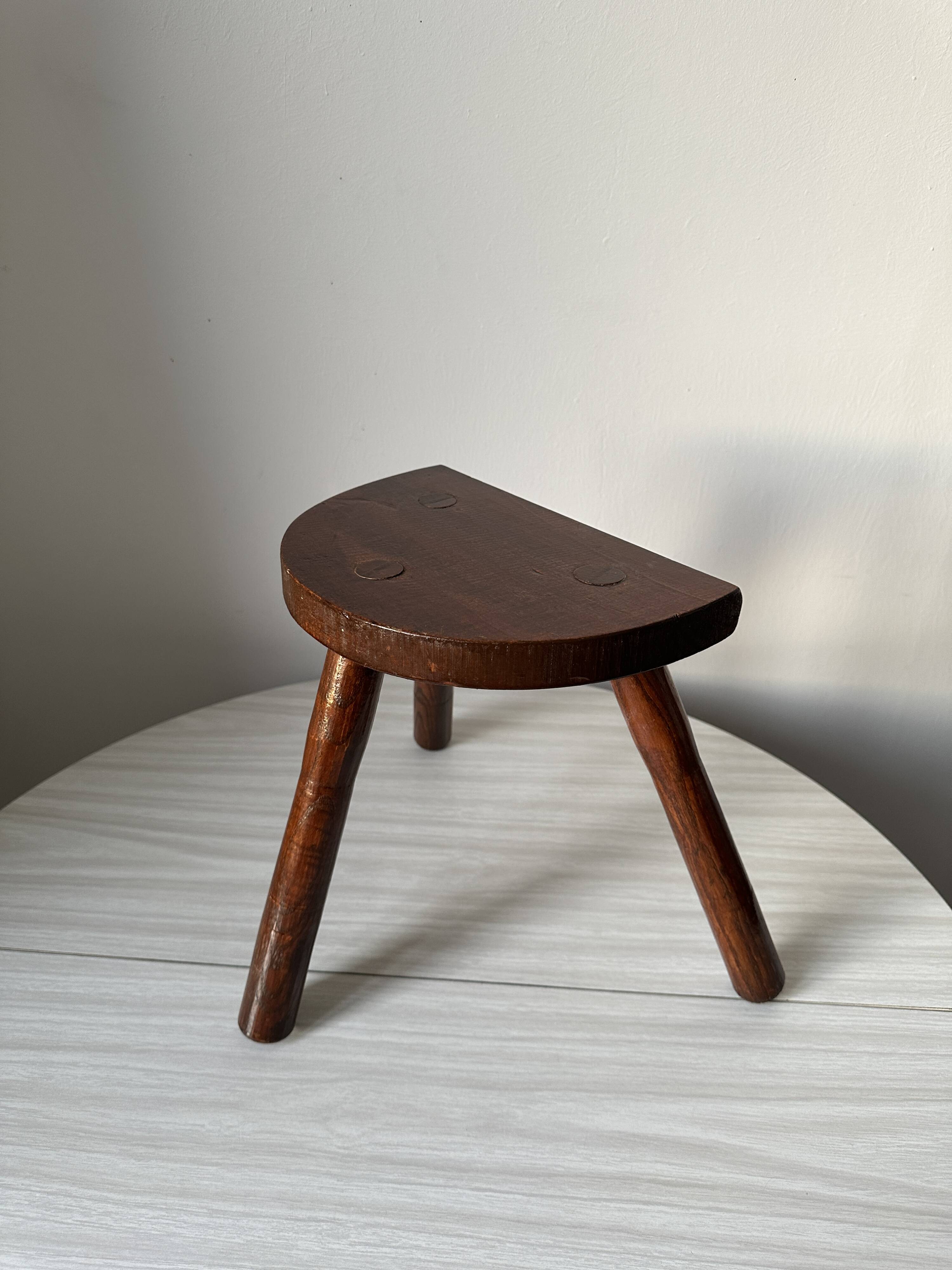 Varnished wooden stool with three legs