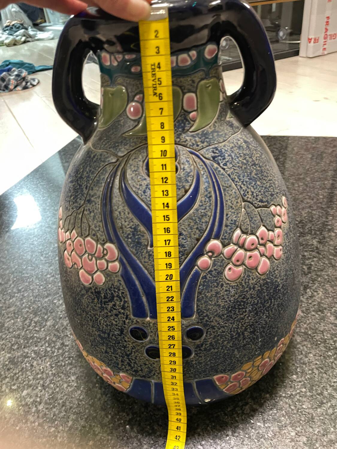Large relief vase with parrot design
