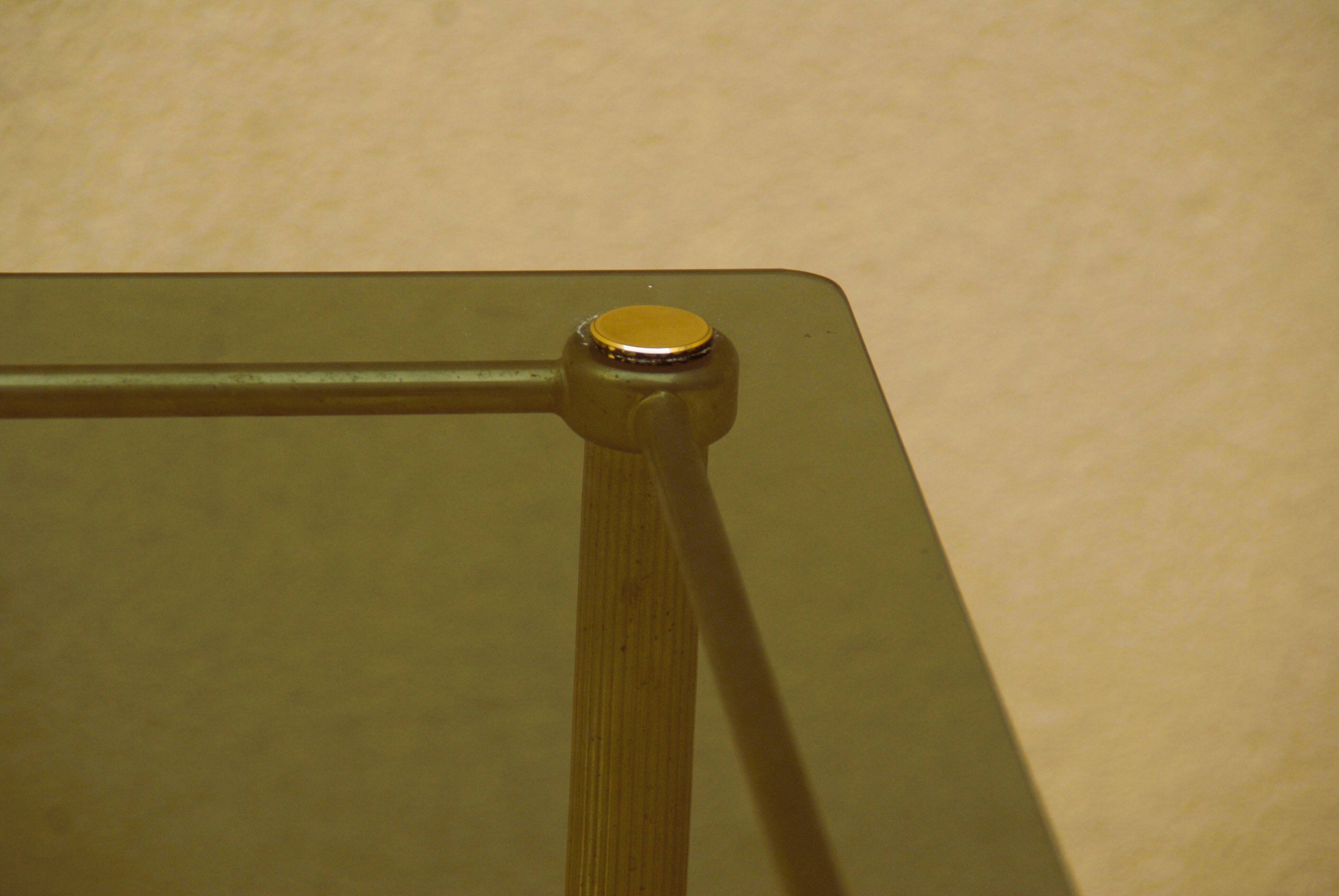 Antique brass serving trolley with smoked glass top, Louis XVI style.