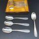 Dessert spoons in silver-white metal