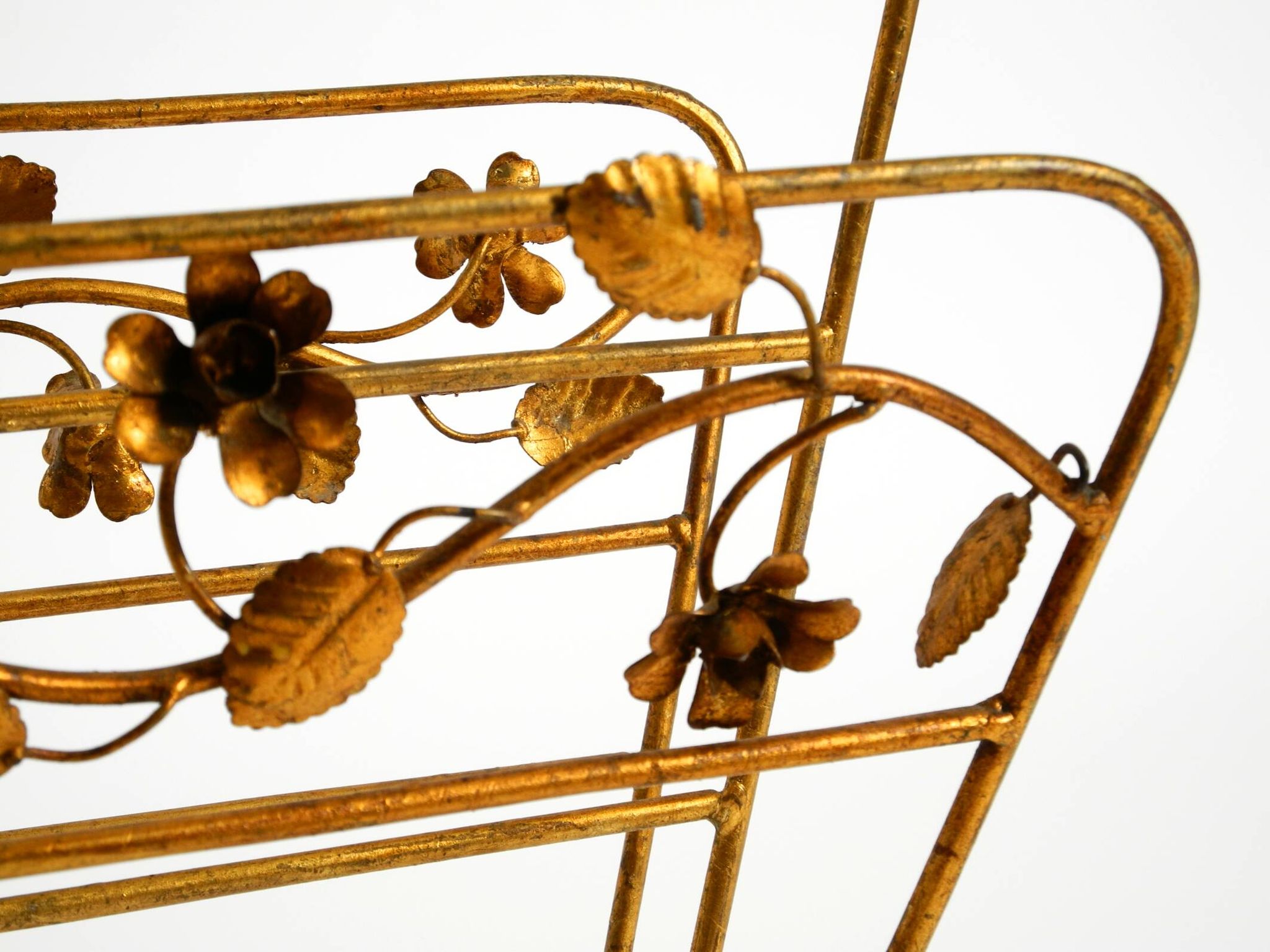 Extraordinary mid-century newspaper and magazine rack with a gilded metal