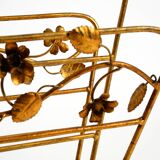 Extraordinary mid-century newspaper and magazine rack with a gilded metal