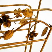 Extraordinary mid-century newspaper and magazine rack with a gilded metal