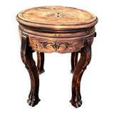Old wooden saddle pedestal table with claw feet