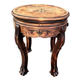 Old wooden saddle pedestal table with claw feet