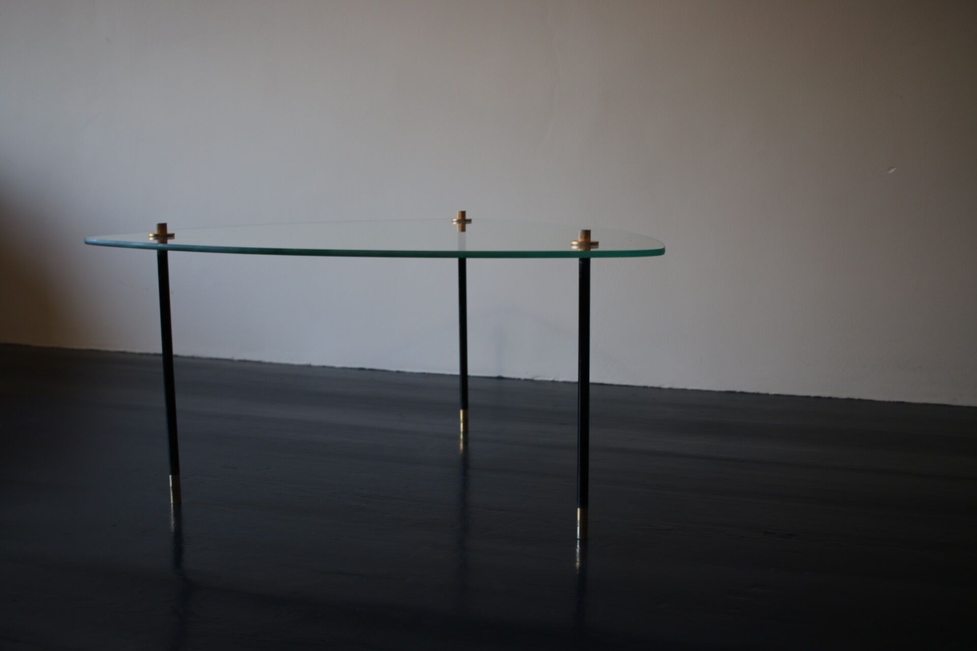 Vintage glass and black-painted brass side table