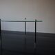 Vintage glass and black-painted brass side table