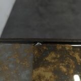 Neoclassical side table in wrought iron and eglomisé glass.