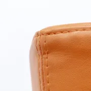 Adjustable orange swivel bar stool