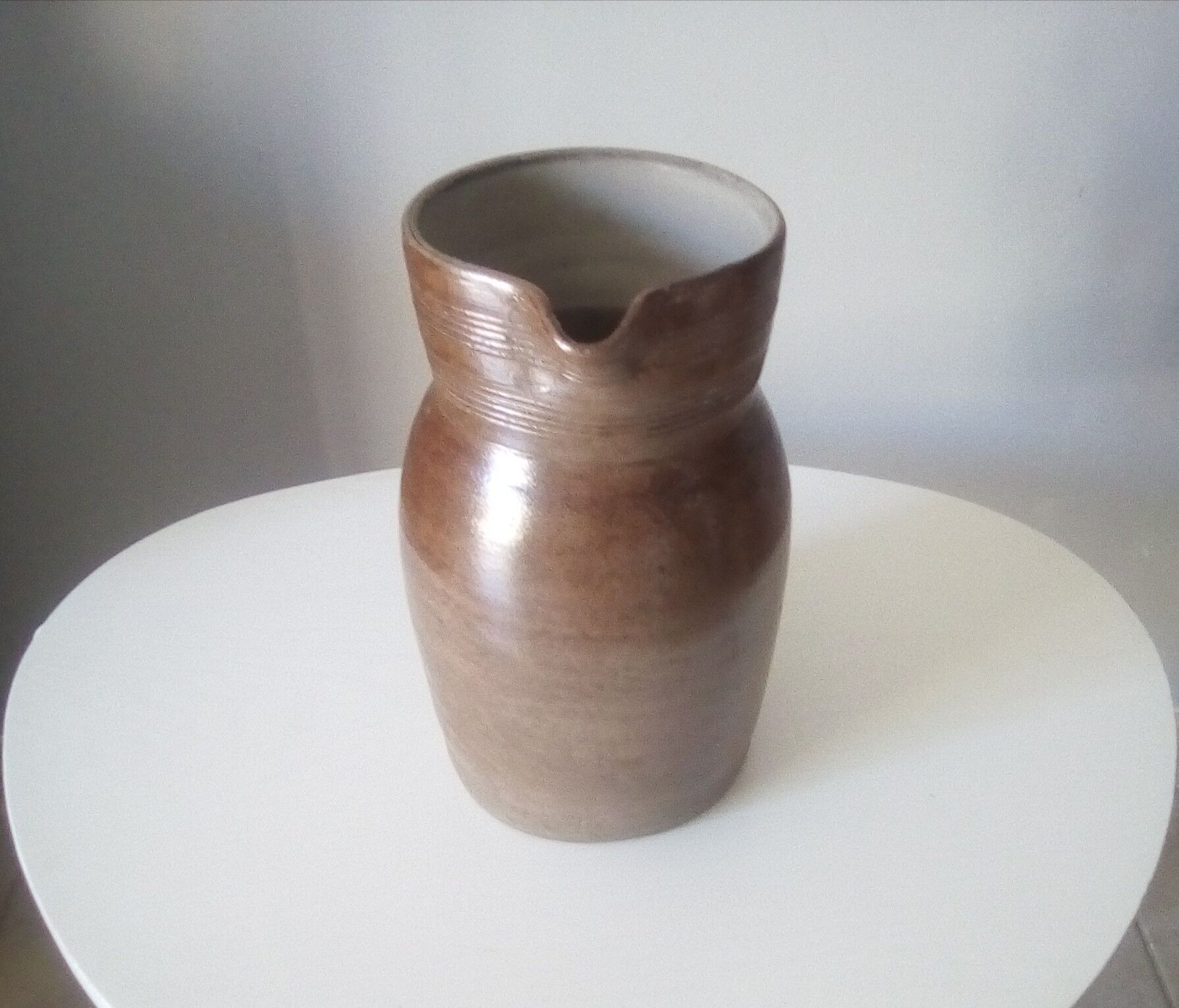 Vintage pitcher in glazed sandstone