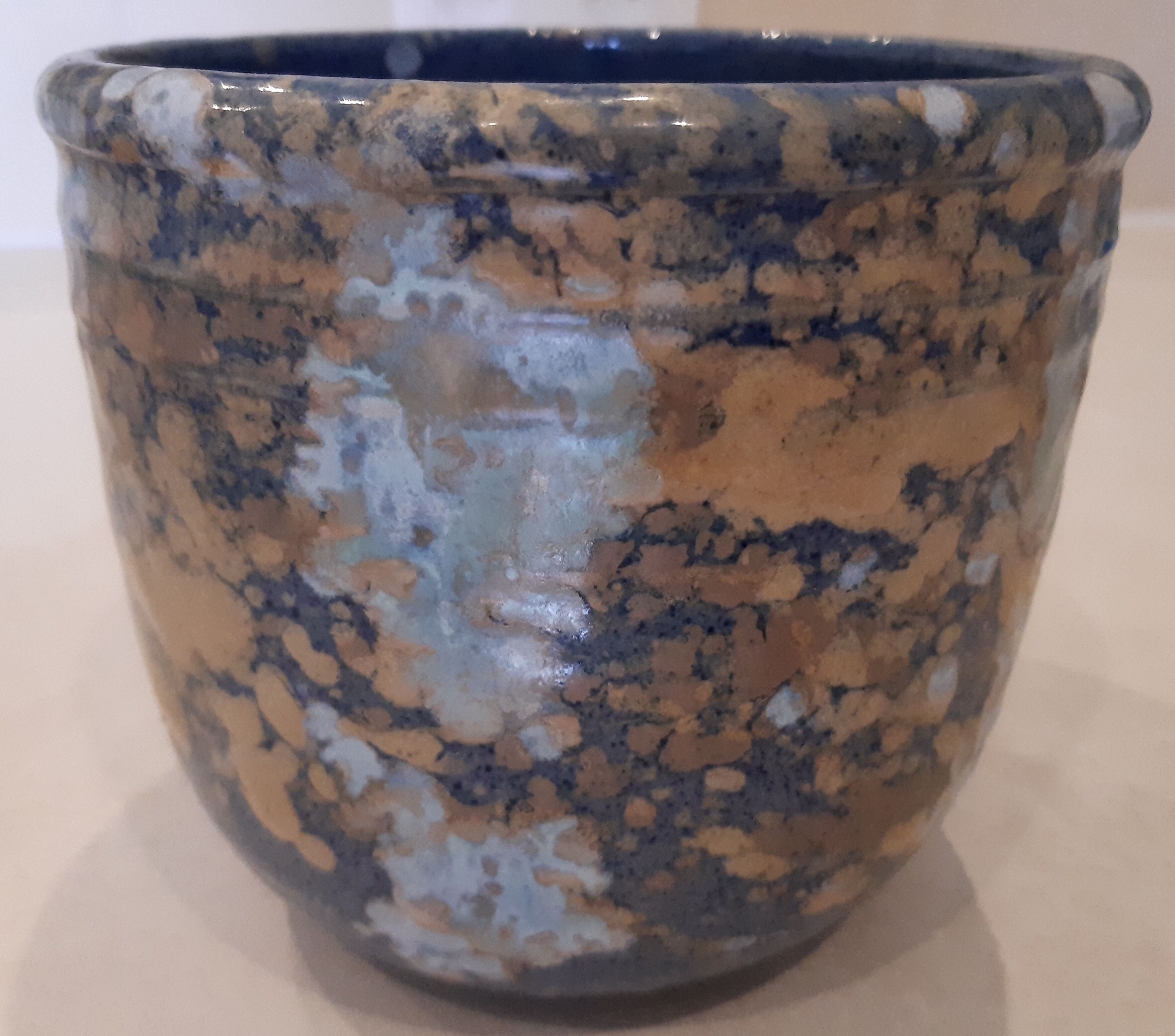 Earthenware pot cover, blue, fawn, grey décor.
