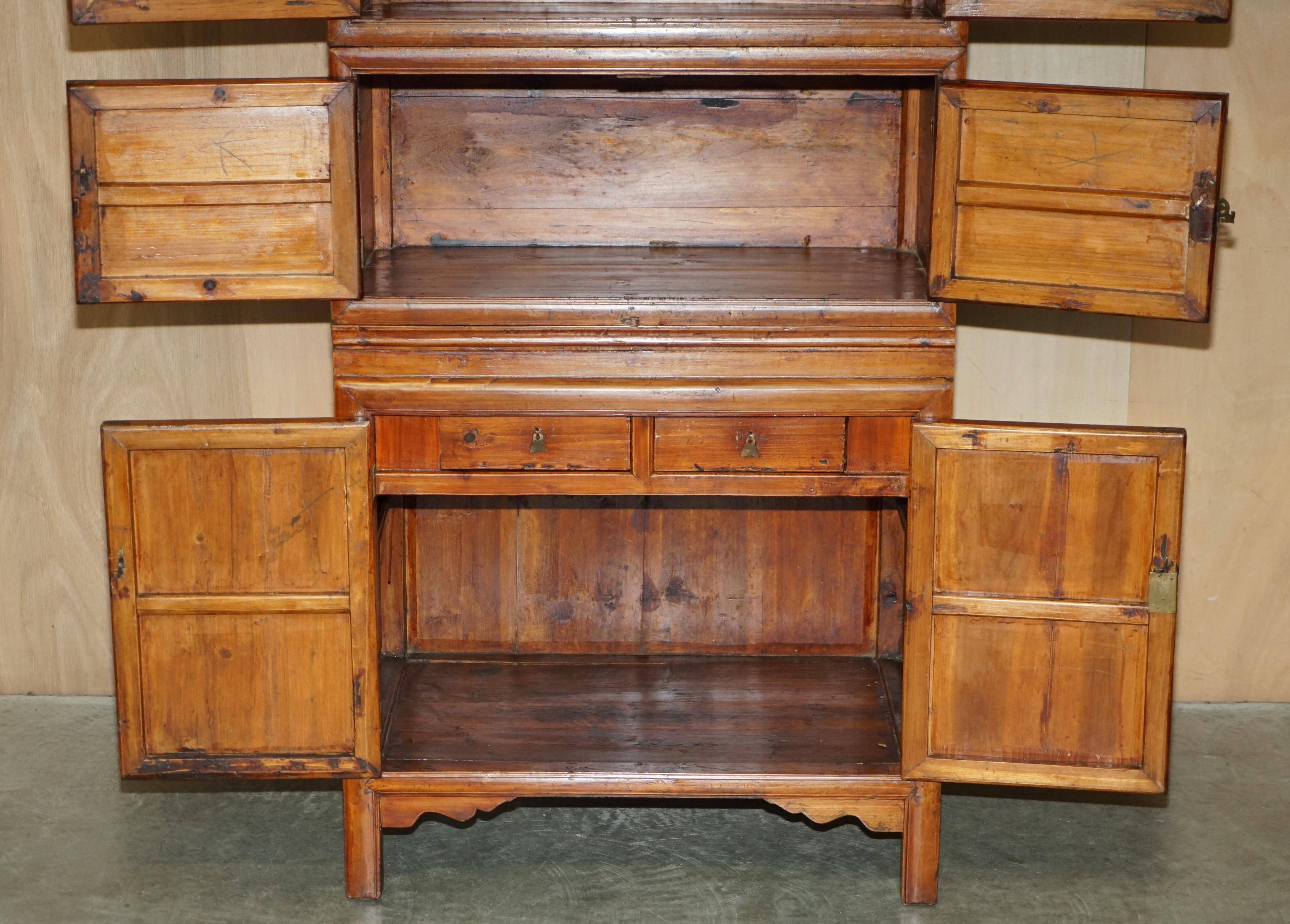 Antique Chinese armoire hand-carved around 1880 with country-style handles.