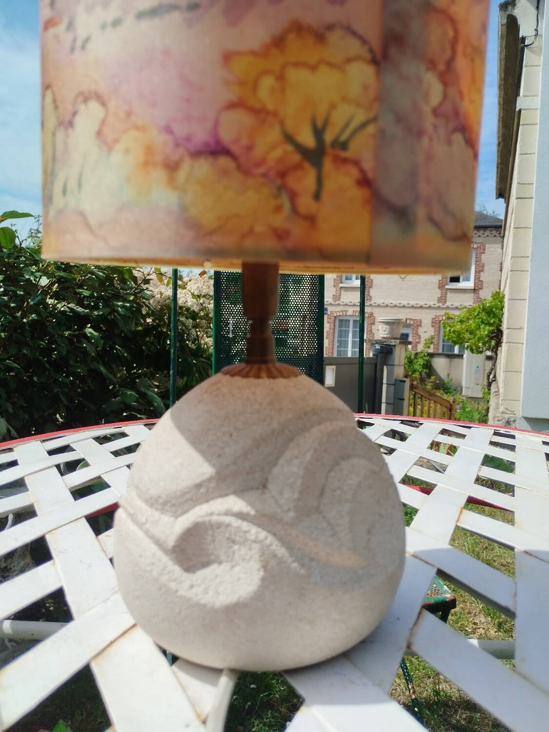 Vintage antique lamp with a stone base.
