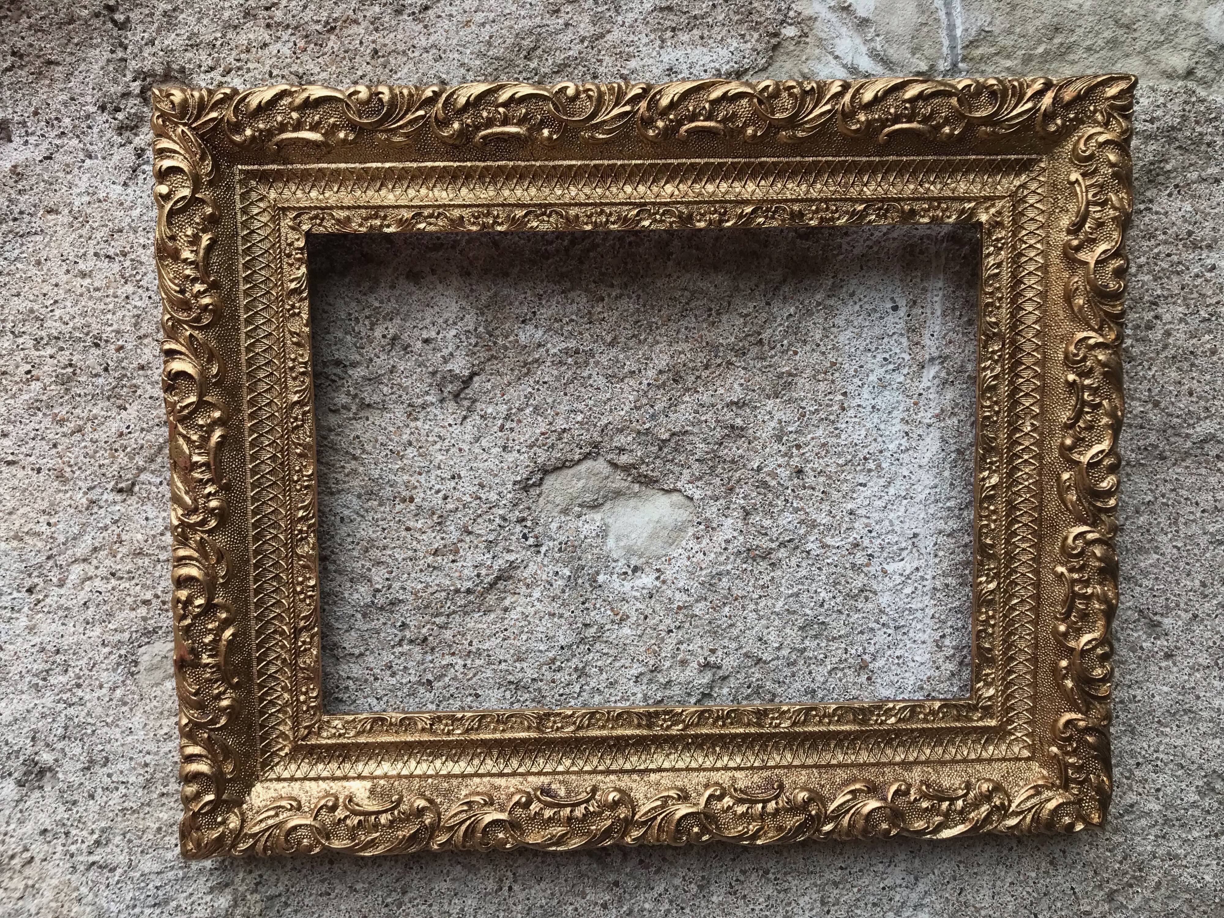 Old gilded frame with leaf