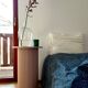 round and fluted bedside table in dusty pink
