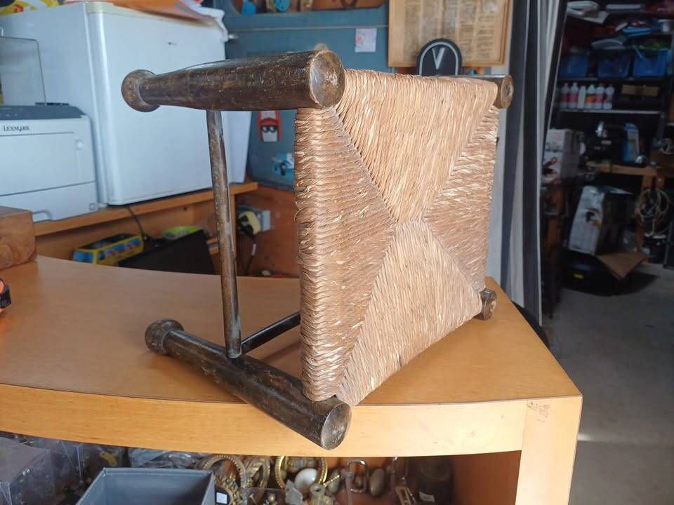 Small rustic vintage stool in wood and straw.