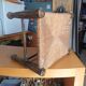 Small rustic vintage stool in wood and straw.