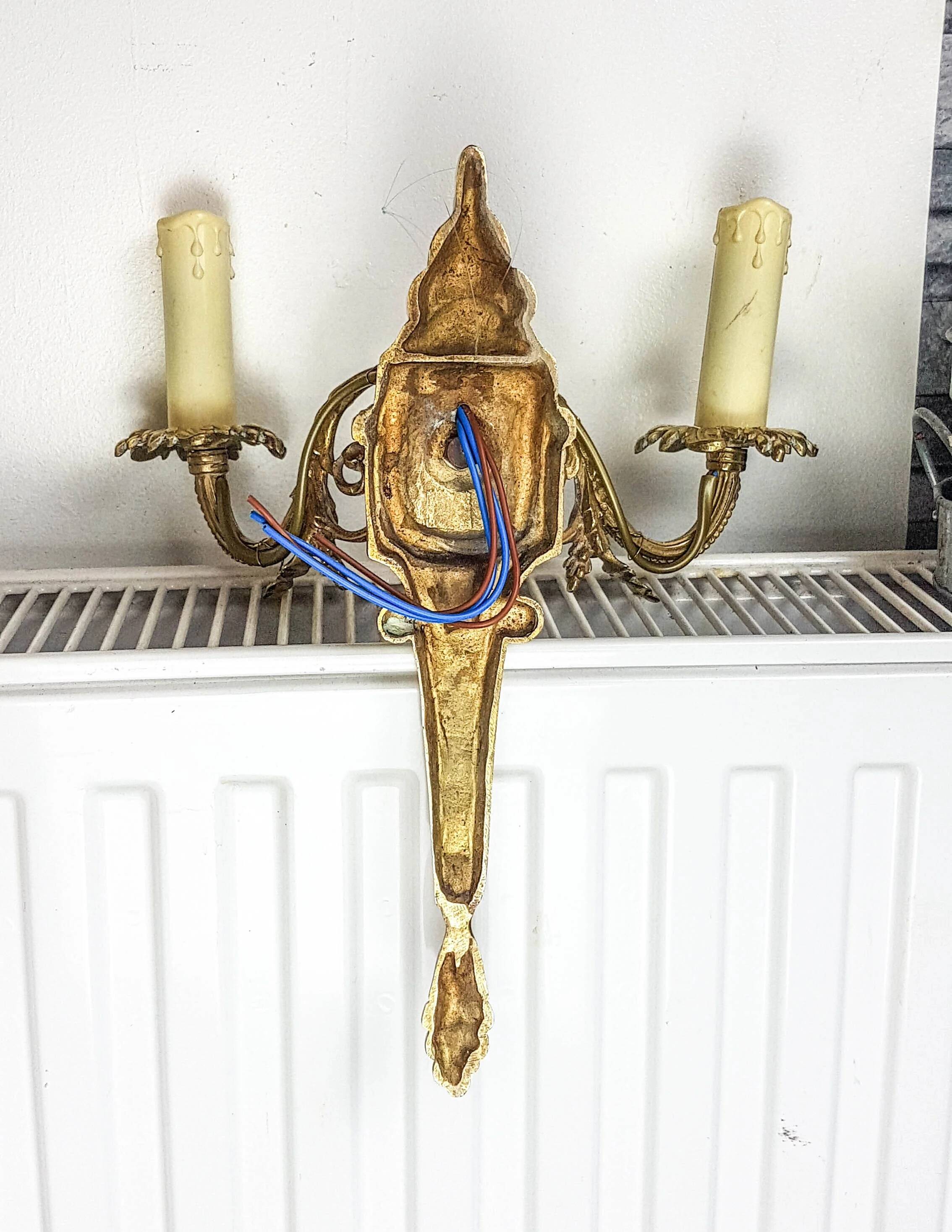 Bronze wall sconce in Empire style