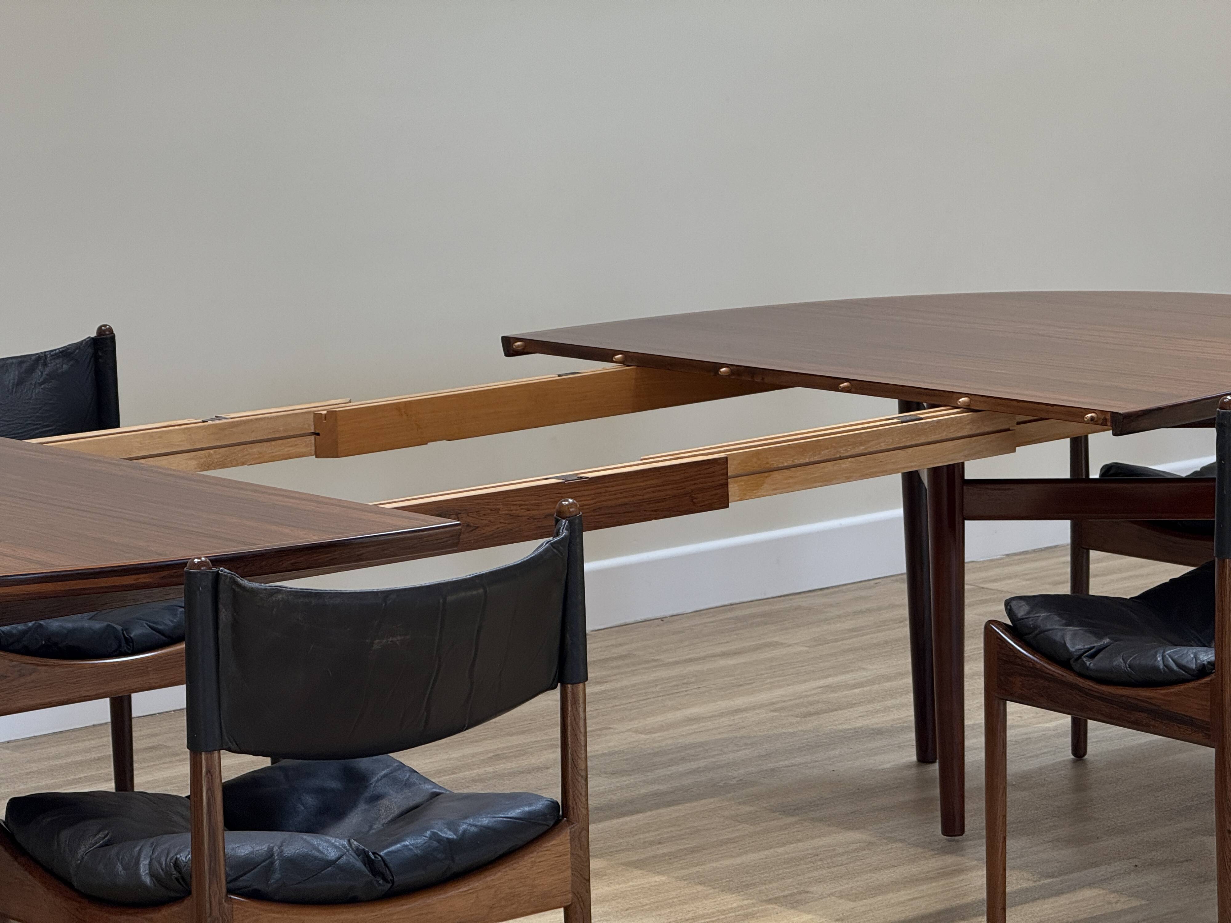 Extendable dining room table and chairs (by Kristian Solmer Vedel)