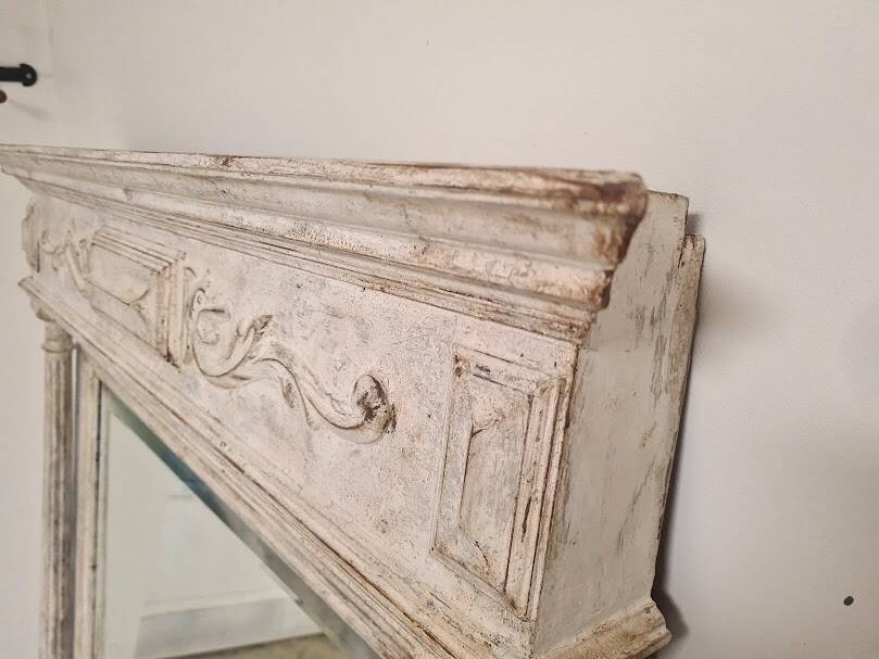 Beveled mercury patinated trumeau mirror