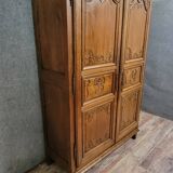 Louis XIV period wardrobe in solid oak, decorated with superb carvings