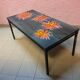 Vintage coffee table ceramic tray decorating orange flowers on grey background