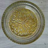 Empty round pockets of iridescent transparent glass of yellow sticks
