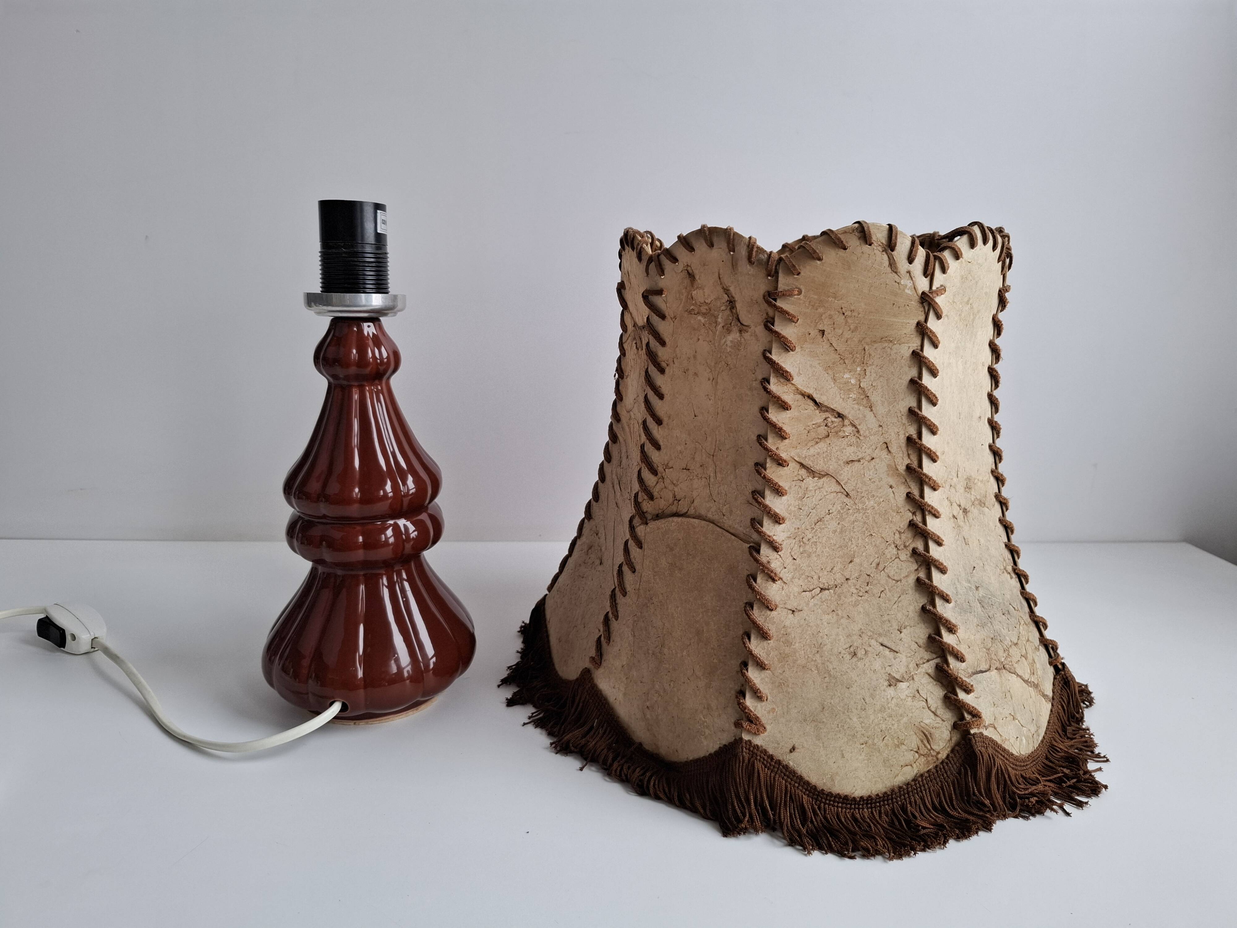 Vintage ceramic table lamp with hand-stitched leather shade, 1980s.