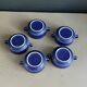 Set of 5 blue Klein ceramic tea cups with saucers.