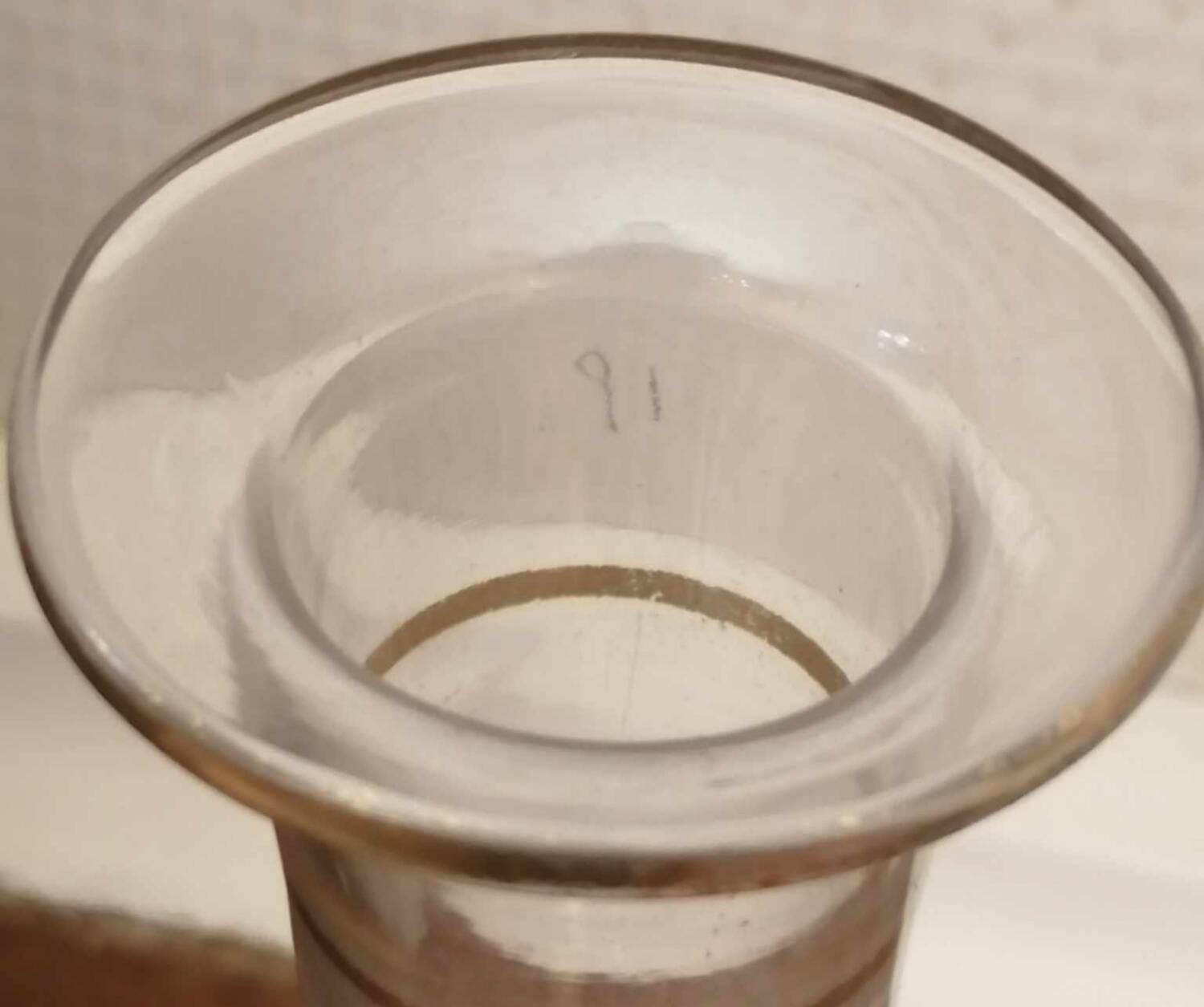 Old crystal decanter with gold decoration