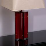 Red metal sculptural table lamp with oversized lamp shade circa 1980