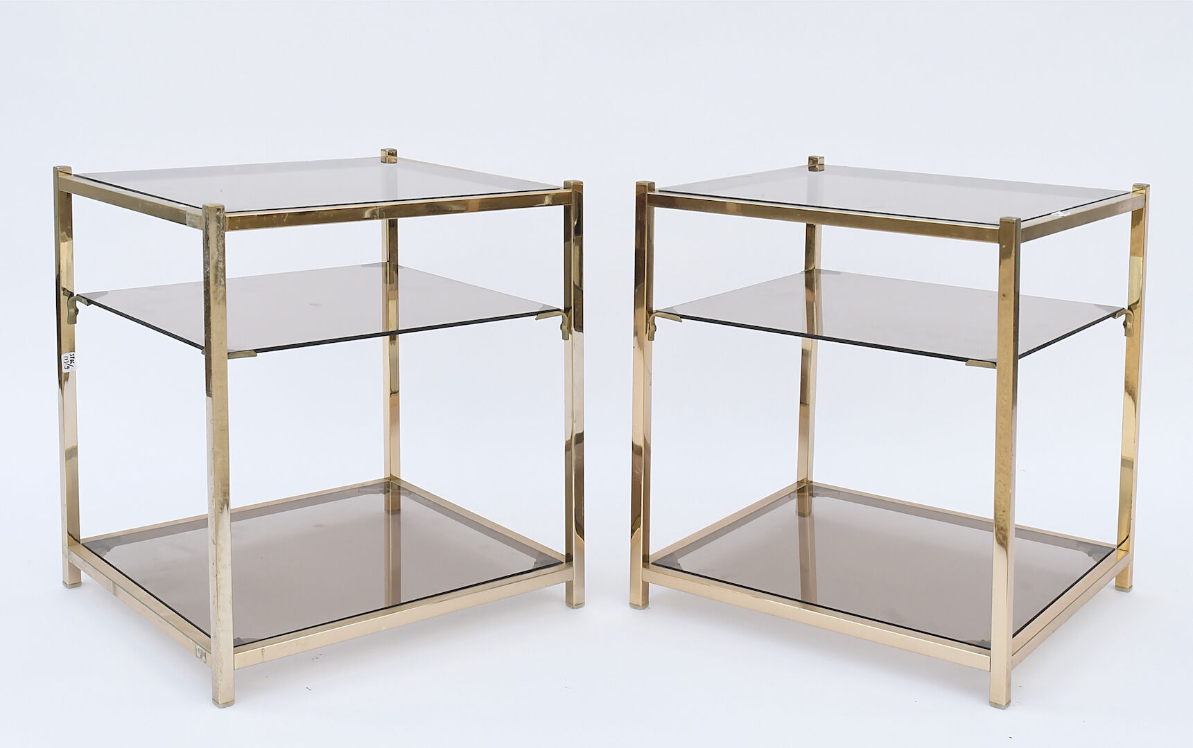 Pair of sofa tips in gilded metal and glass