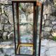 Pair of display cases in magnifying glass and black & gold lacquer, 20th century period