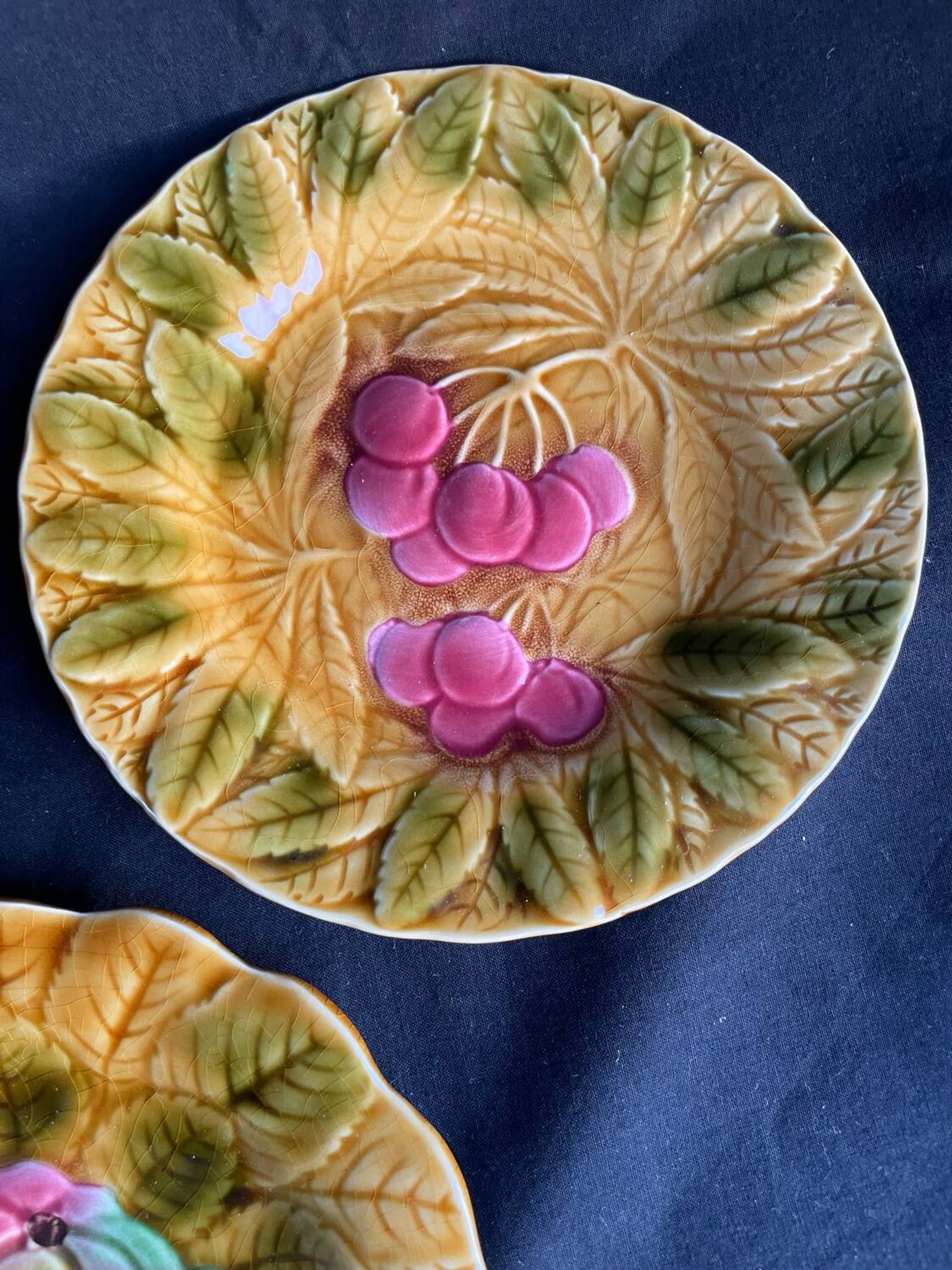 Together, four antique Sarreguemines barbotine plates.