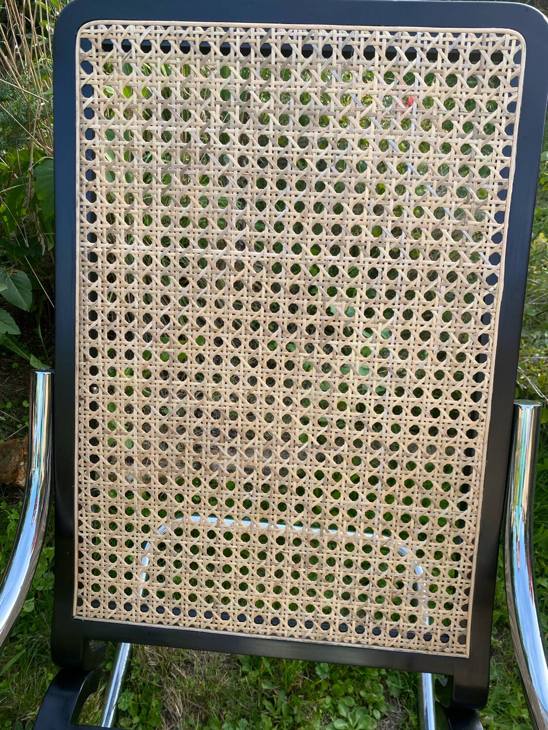Chrome and cane rocking chair