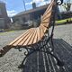 Wooden garden bench with cast iron base