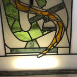 Old stained glass sign with deciduous decoration and microscope