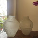 2 semi-opaque glass vases with relief bird designs.