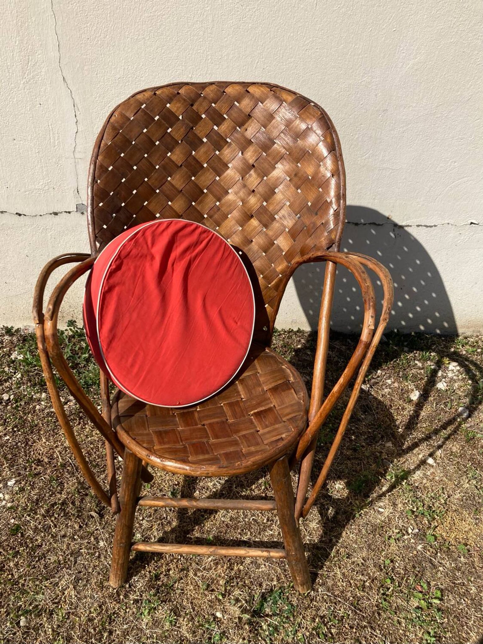 Vintage 1970s armchair in curved woven chestnut + seat cushion