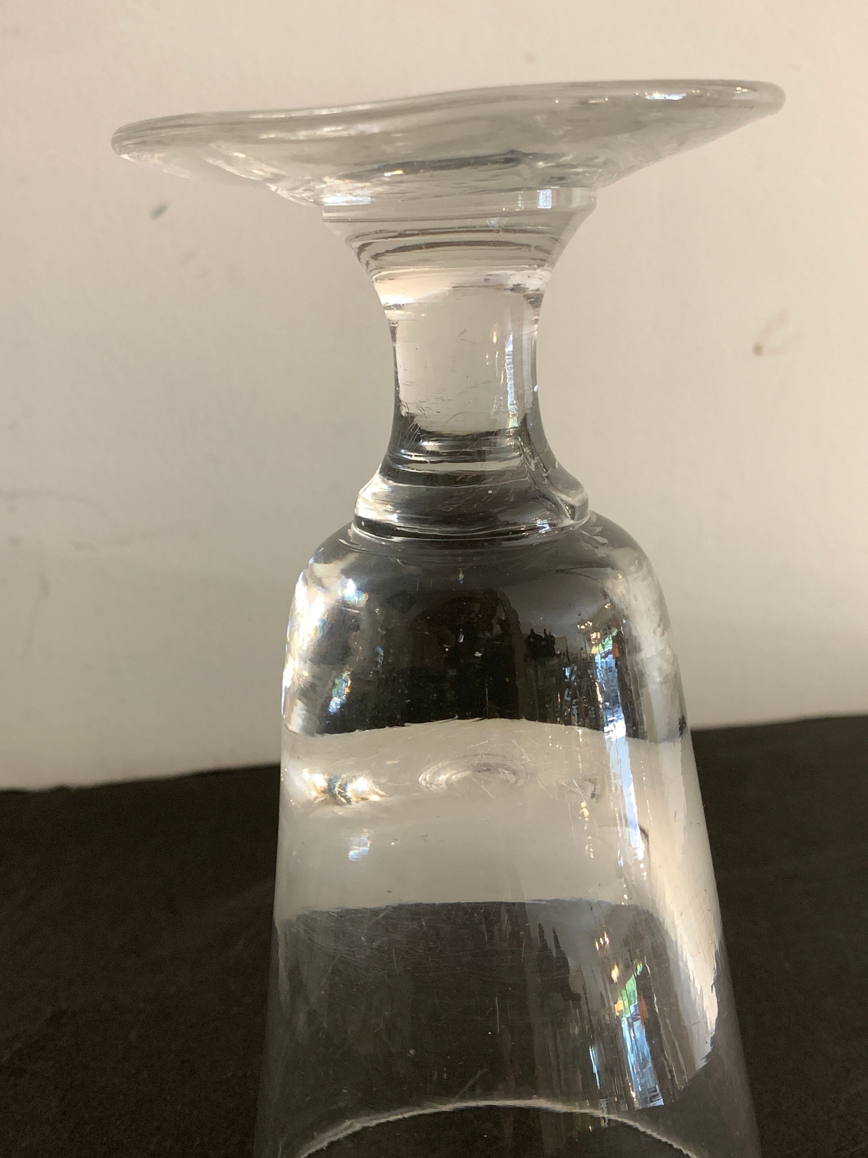 12 old glasses on foot at bistro or absinthe