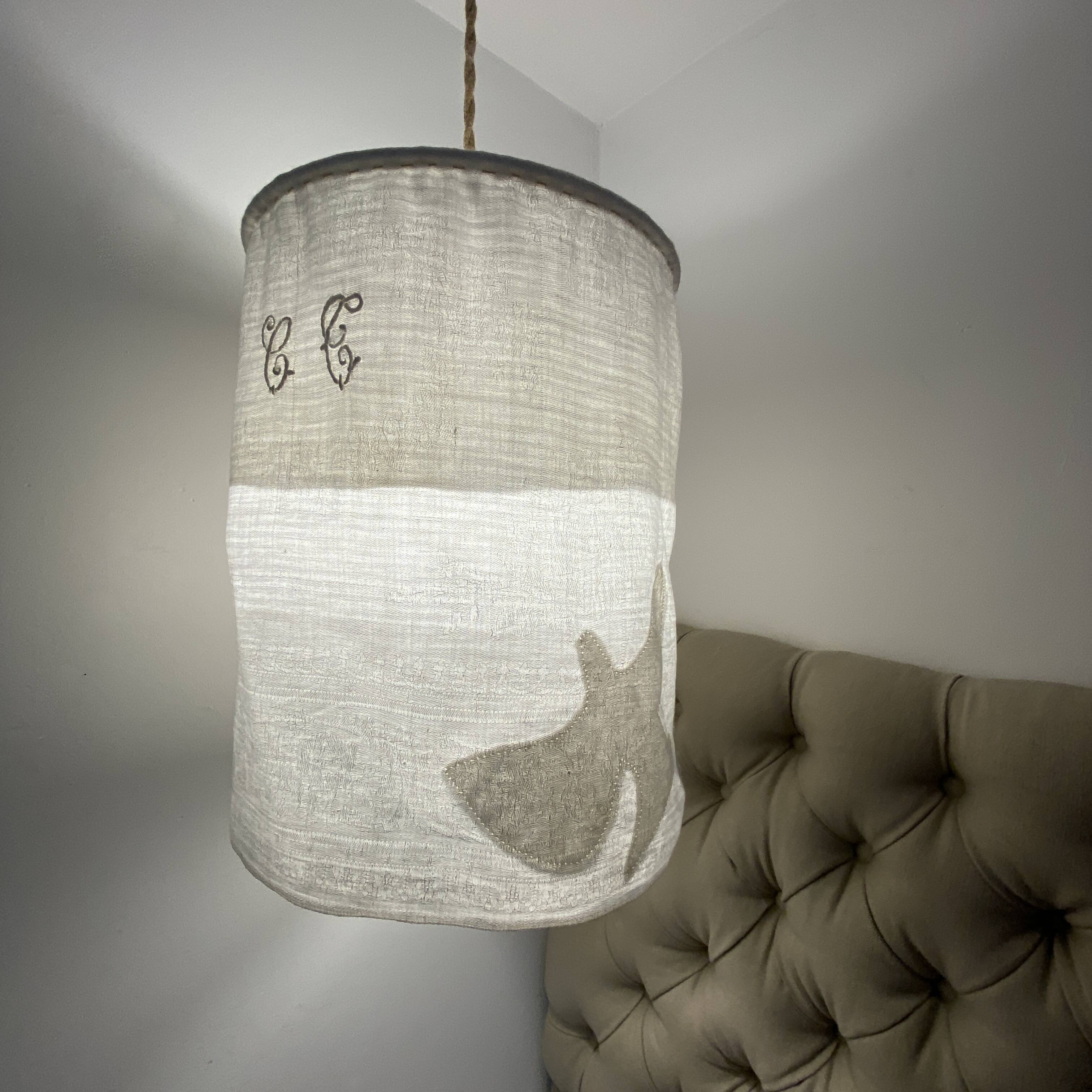 Old linen drapery with monogram and bird by Georges Braque