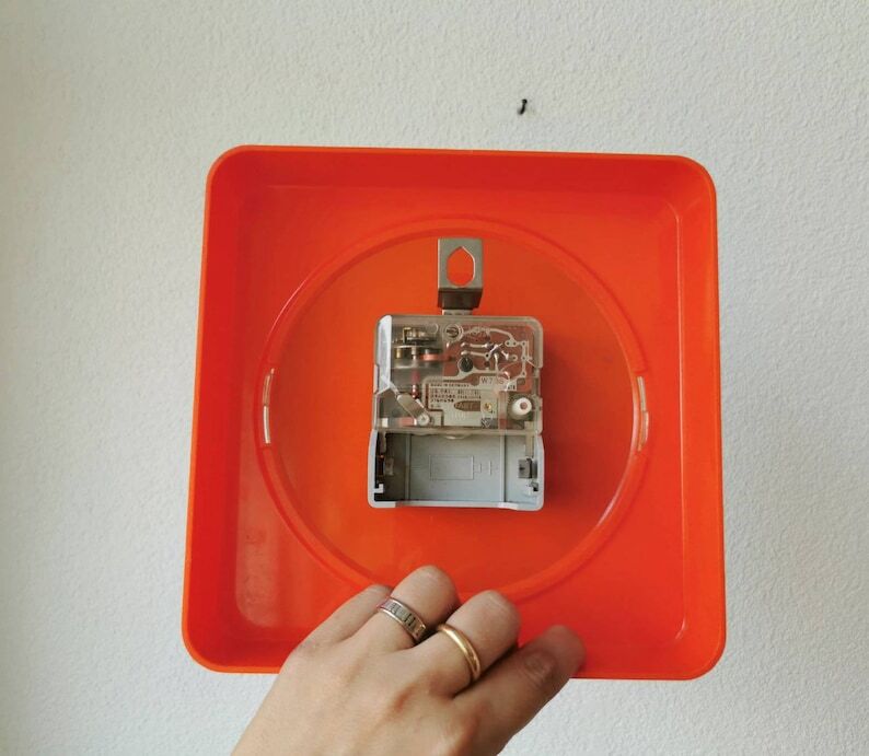 Vintage orange wall clock made of Inproco plastic, 1970
