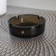 Dark smoked glass ashtray from the 1970s.