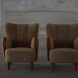 Pair of Danish Art Deco modern lounge chairs in sheepskin with lambswool and elm, 1940s.