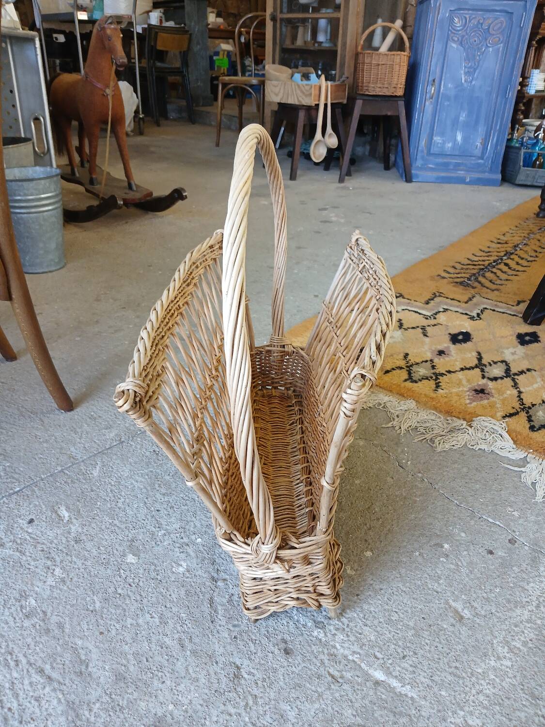 Antique wicker magazine rack