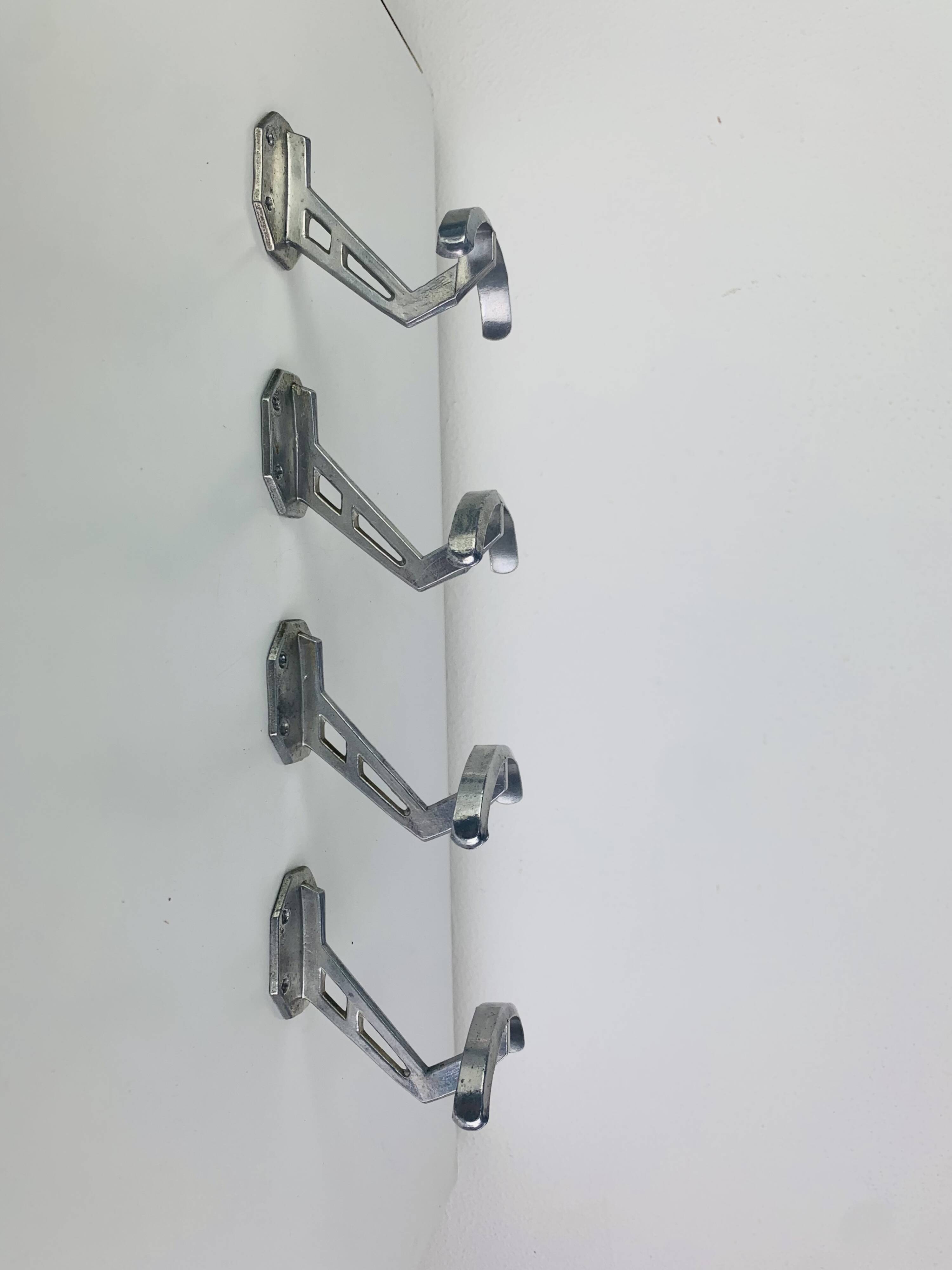 4 wall hooks in aluminium, 1950s