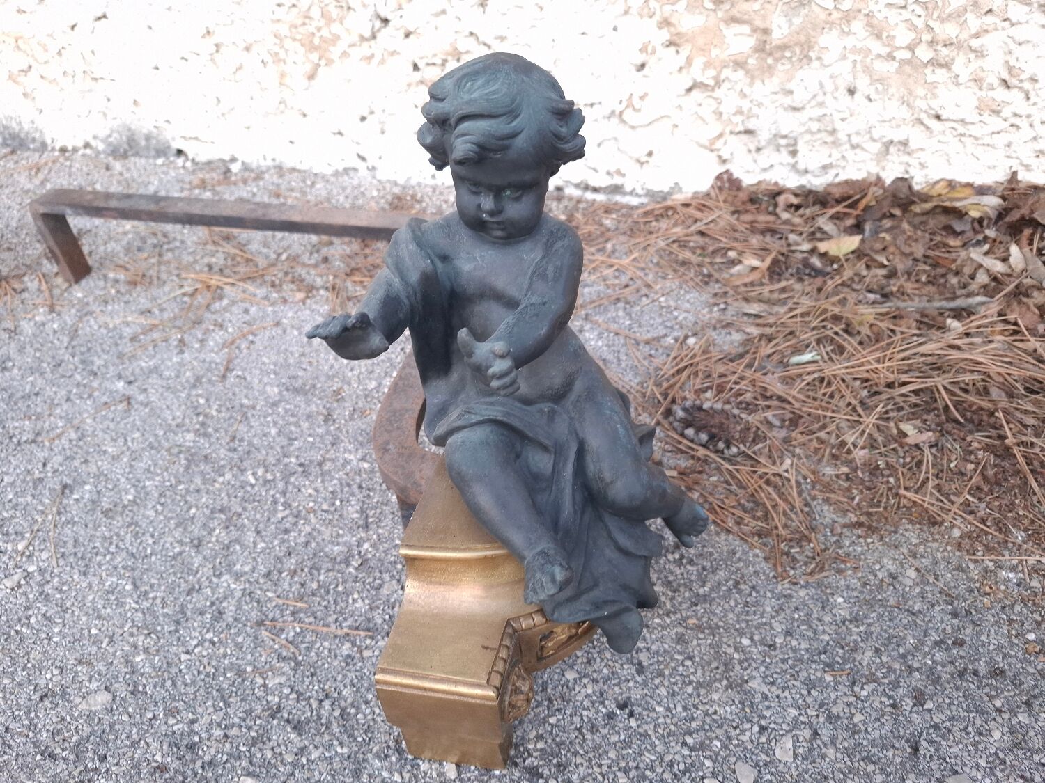 XIXth-century andirons decorated with cherubs and angels