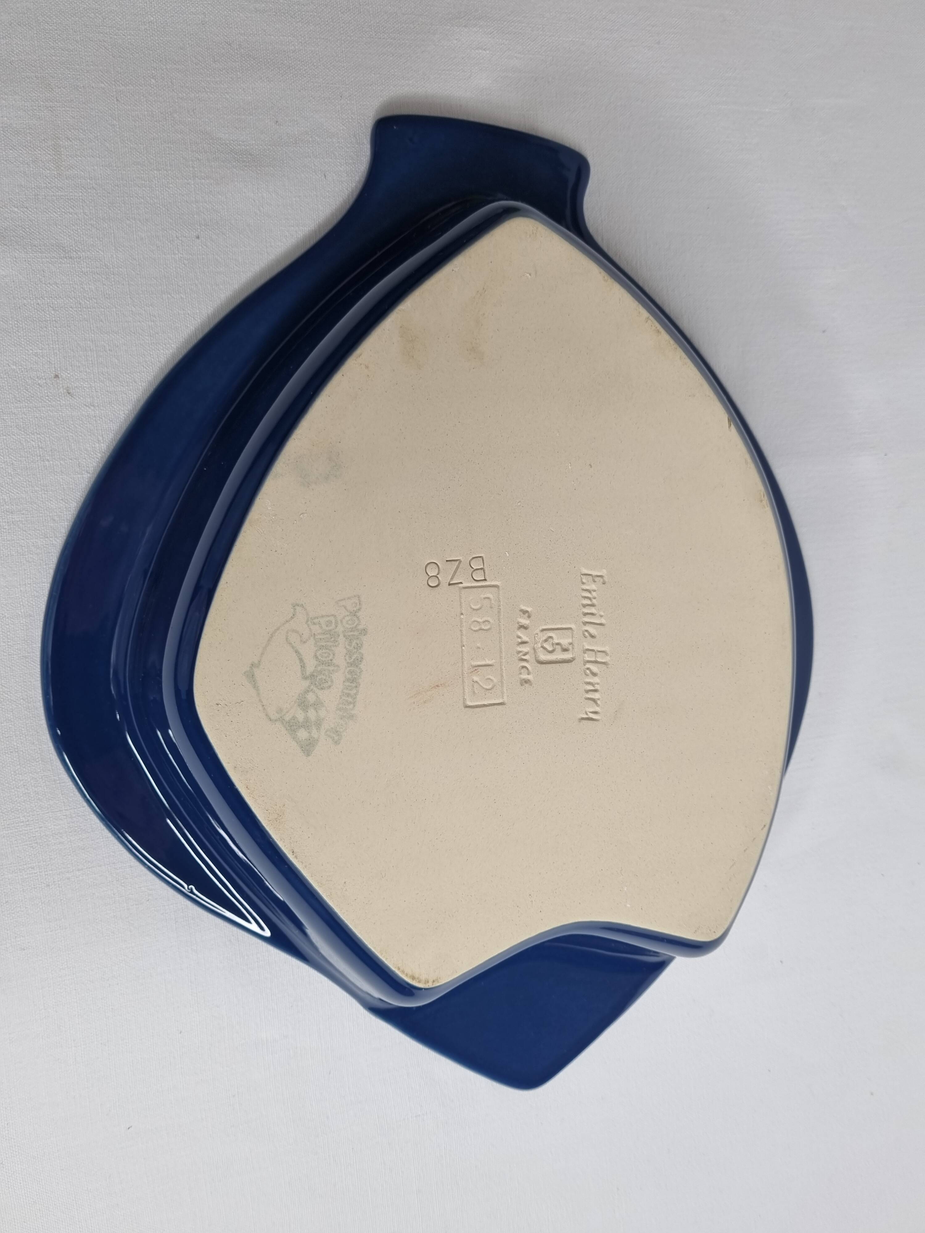 Blue ceramic serving dish in the shape of a fish signed Émile Henry