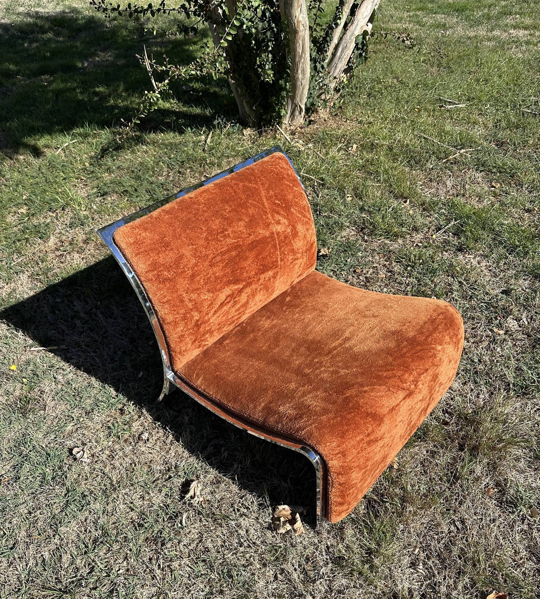 Chrome steel armchair and orange fabric by Vittorio Introini