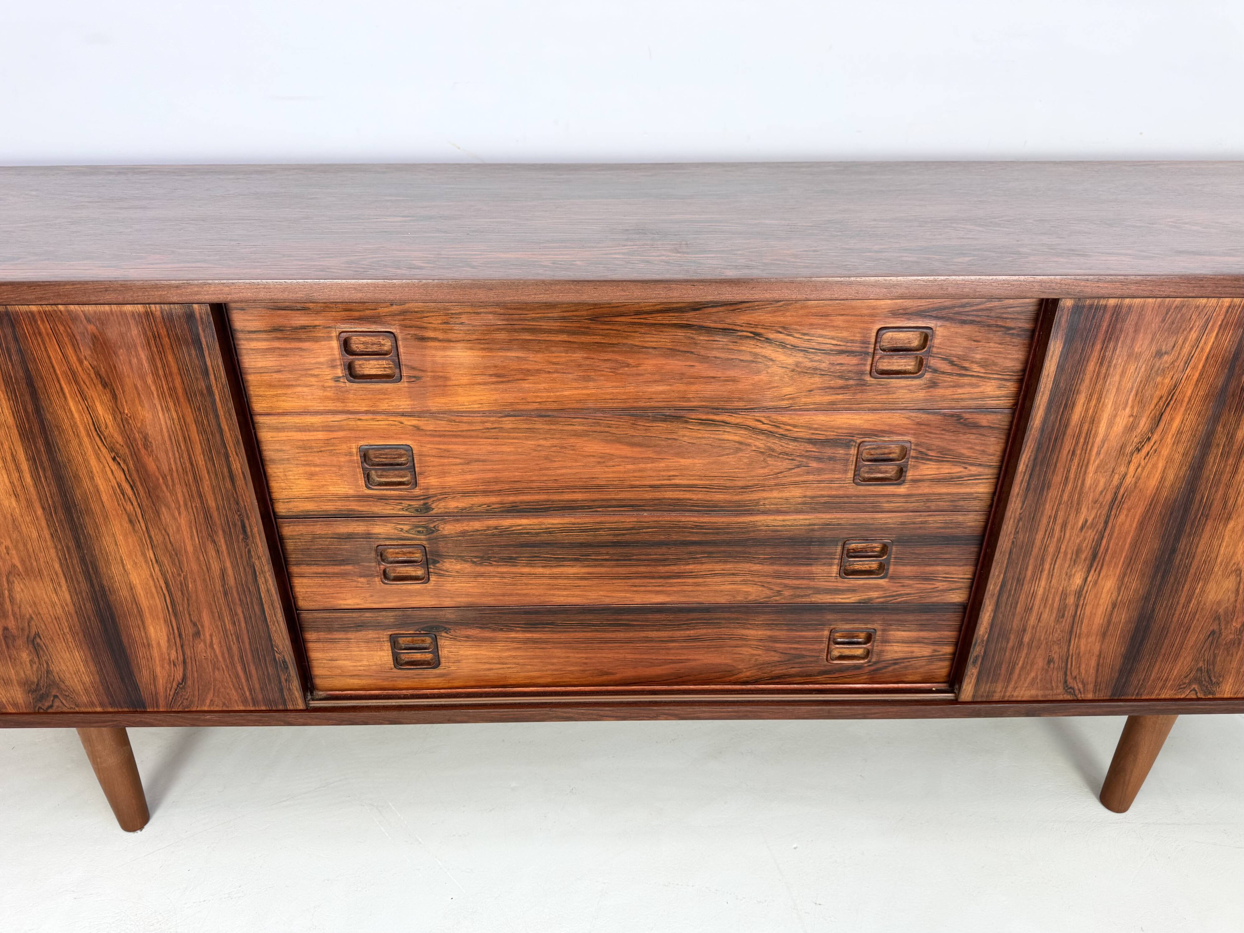 Danish rosewood vintage sideboard with sliding teak doors from the 1960s